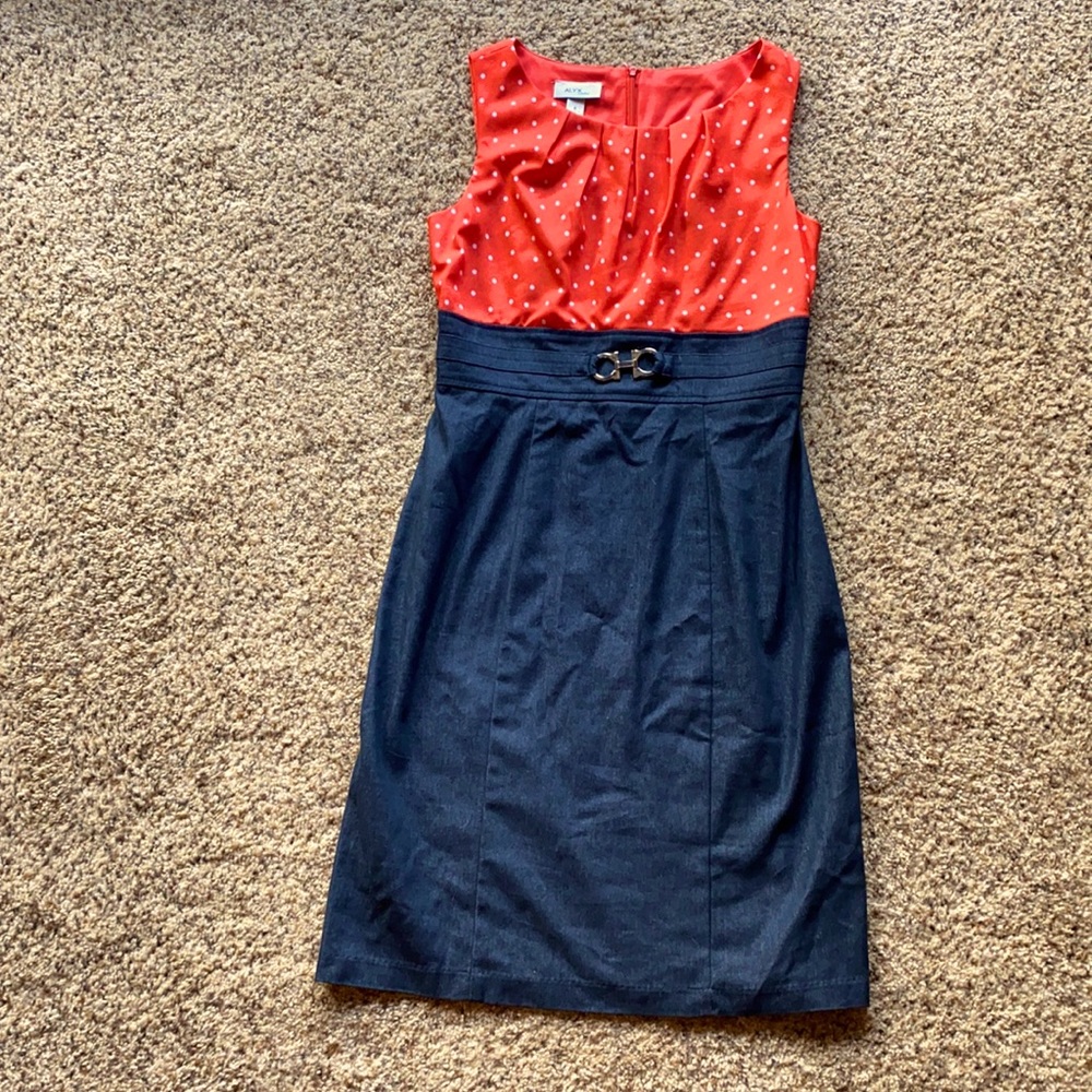 Sleeveless dress. Just below knee